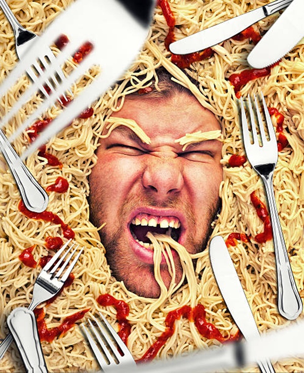 Man eating pasta, dinner time