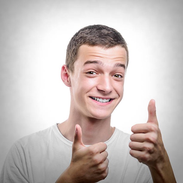 Handsome man with thumb up. Toned photo.