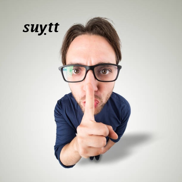 Man say Shhh with hand gesture looking in camera